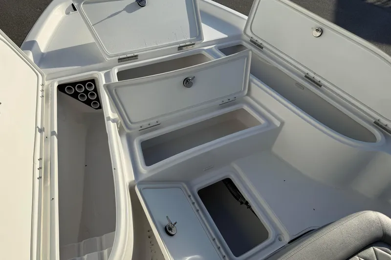 Slide: The Image of 2026 Blazer Bay PURE BAY 2200 boat storage compartments and rod holders, open and ready for use. - 13