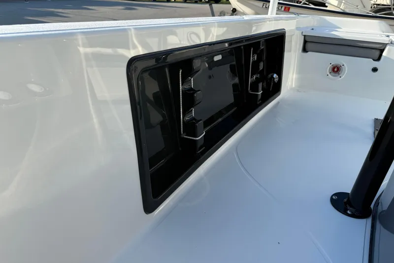 Slide: The Image of 2026 Blazer Bay PURE BAY 2200 boat interior with sleek white finish and storage compartment. - 16