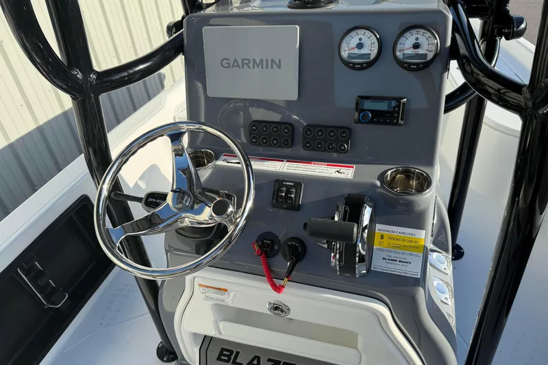Slide: The Image of 2026 Blazer Bay PURE BAY 2200 boat console with Garmin navigation and steering wheel. - 20