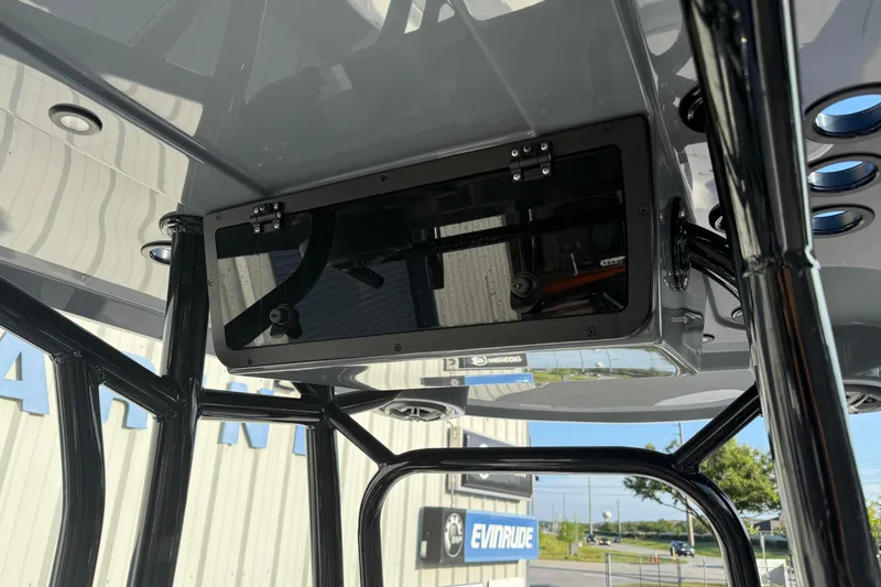 Slide: The Image of 2026 Blazer Bay PURE BAY 2200 T-top console with mounted electronics and sturdy framework. - 21