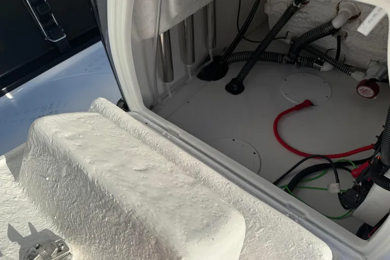 Slide: The Image of 2026 Blazer Bay PURE BAY 2200 boat compartment with wiring and storage space. - 23