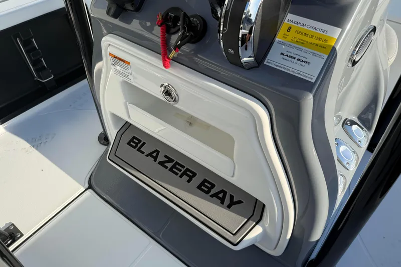 Slide: The Image of 2026 Blazer Bay PURE BAY 2200 boat console with steering wheel and capacity label. - 24