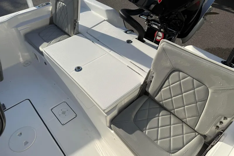 Slide: The Image of 2026 Blazer Bay PURE BAY 2200 boat interior with gray quilted seats and storage compartments. - 26