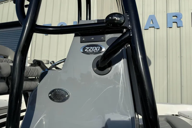 Slide: The Image of 2026 Blazer Bay PURE BAY 2200 boat console with logo and seating detail. - 3
