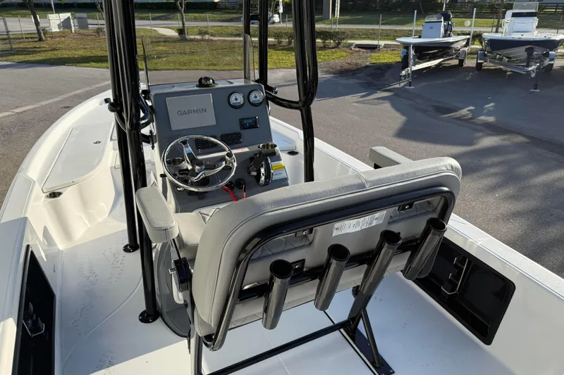 Slide: The Image of 2026 Blazer Bay PURE BAY 2200 boat interior with Garmin navigation system and rod holders. - 30