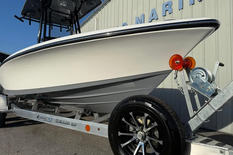 Slide: The Image of 2026 Blazer Bay PURE BAY 2200 boat on trailer, side view, outdoors. - 4
