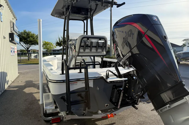 Slide: The Image of 2026 Blazer Bay PURE BAY 2200 boat with powerful outboard motor, parked outdoors. - 8