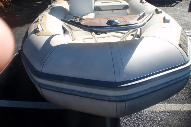 Slide: The Image of 2014 Zodiac Yachtline 420 inflatable boat, parked on asphalt, front view. - 4