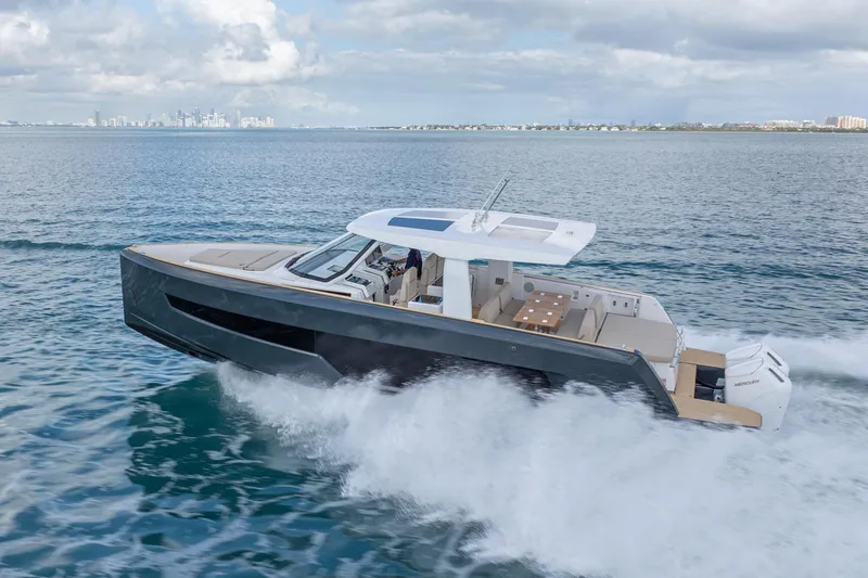 Slide: The Image of 2026 Fjord 41 XP yacht cruising on open water, city skyline in background. - 12