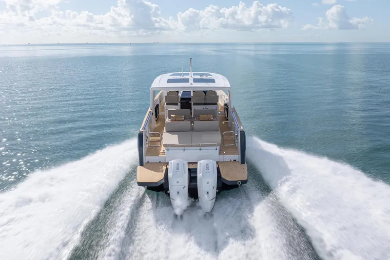 Slide: The Image of 2026 Fjord 41 XP yacht cruising on open water, showcasing powerful dual engines. - 13