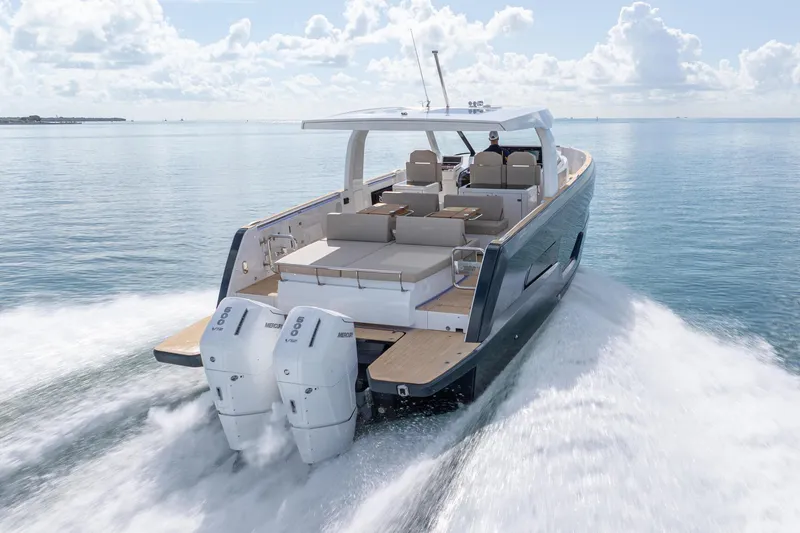 Slide: The Image of 2026 Fjord 41 XP yacht cruising on open water, showcasing sleek design and powerful engines. - 14
