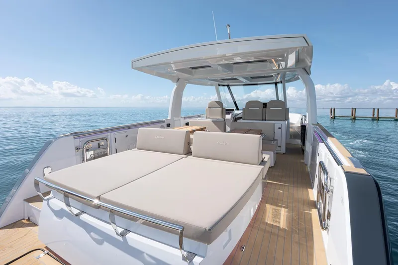 Slide: The Image of Luxurious 2026 Fjord 41 XP yacht with spacious deck and seating, cruising on calm ocean waters. - 15