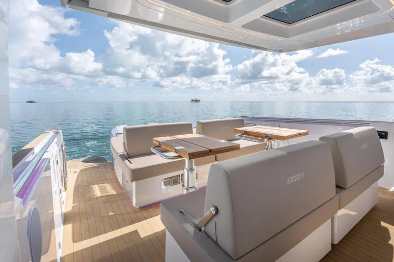 Slide: The Image of Luxurious 2026 Fjord 41 XP yacht interior with elegant seating and ocean view. - 16