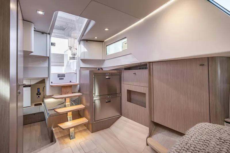Slide: The Image of Modern interior of 2026 Fjord 41 XP yacht with sleek wood finishes and compact design. - 22