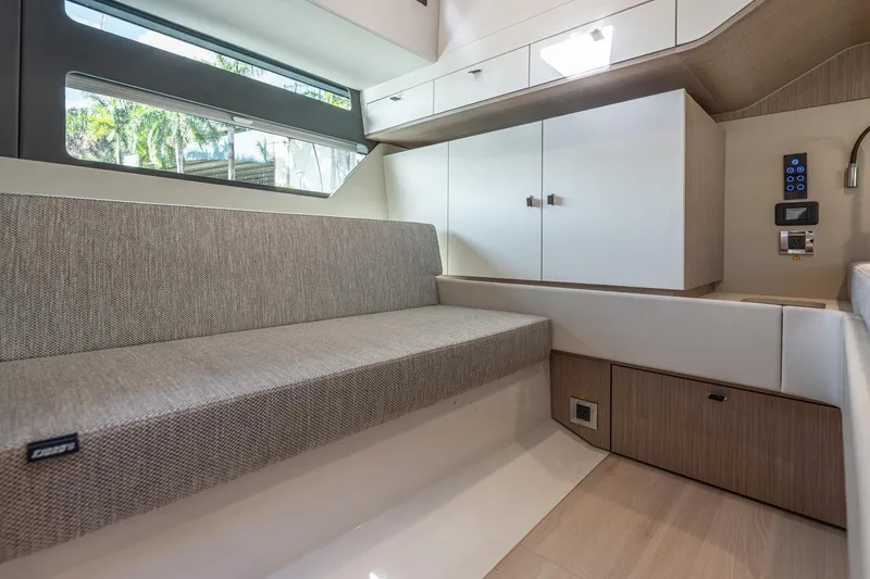 Slide: The Image of Interior of 2026 Fjord 41 XP yacht with modern seating and cabinetry. - 25