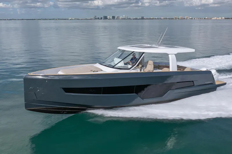 Slide: The Image of 2026 Fjord 41 XP yacht cruising on calm waters under a cloudy sky. - 4