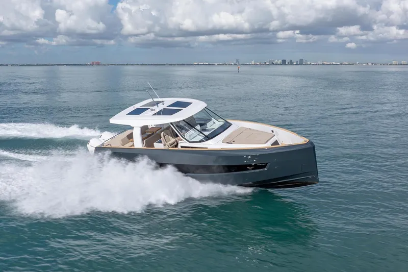 Slide: The Image of 2026 Fjord 41 XP yacht cruising on open water under a cloudy sky. - 7