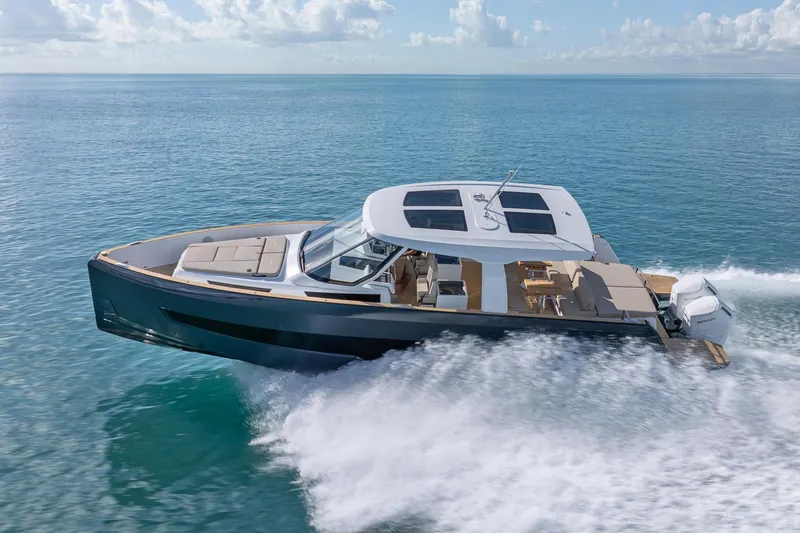 Slide: The Image of 2026 Fjord 41 XP yacht cruising on open water under a clear sky. - 8