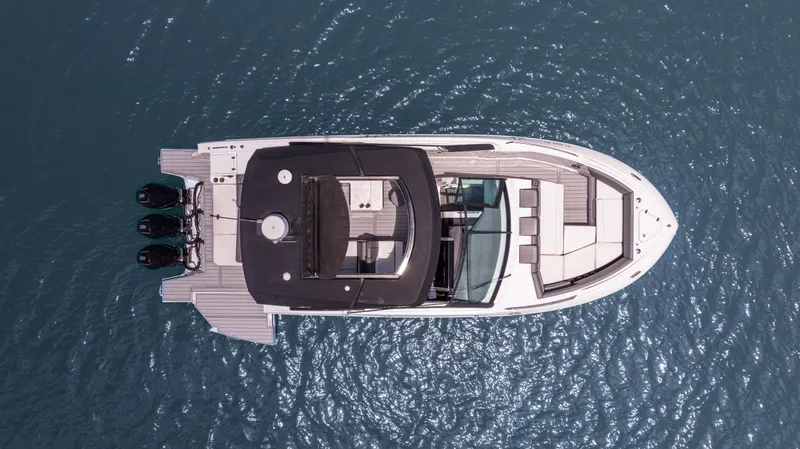Slide: The Image of Aerial view of 2020 Cruisers Yachts 38 GLS OB on water. - 2
