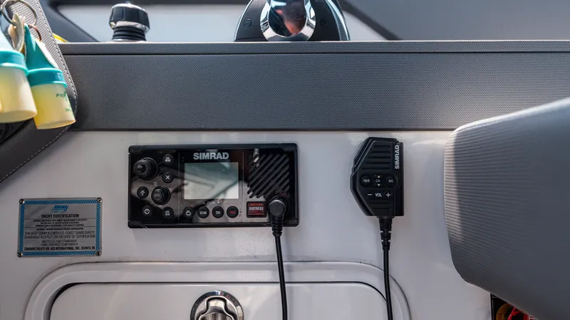 Slide: The Image of Control panel of 2020 Cruisers Yachts 38 GLS OB with Simrad radio equipment. - 29