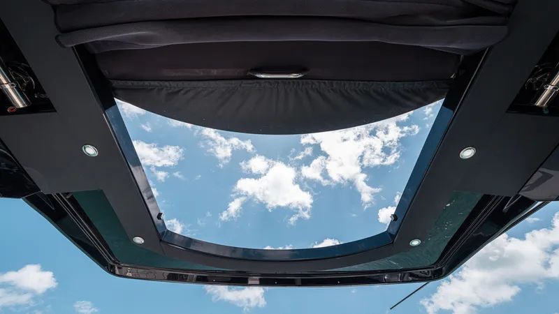 Slide: The Image of Sky view through the sunroof of a 2020 Cruisers Yachts 38 GLS OB. - 34