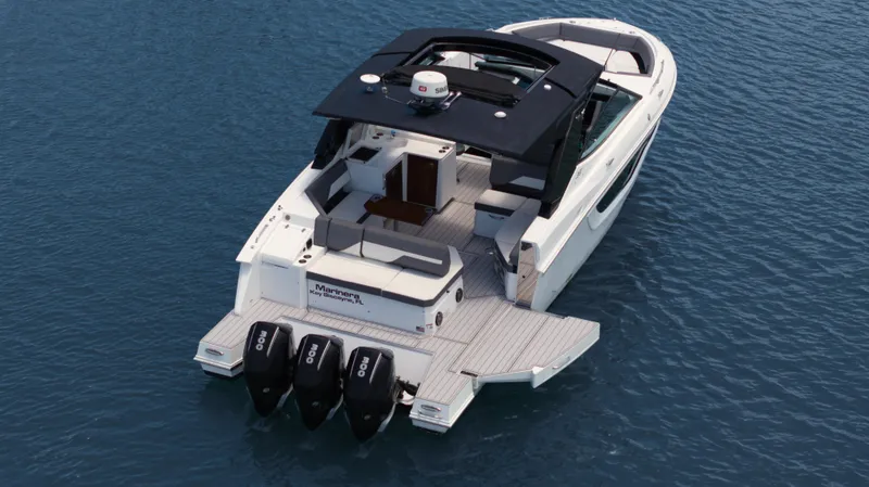 Slide: The Image of 2020 Cruisers Yachts 38 GLS OB on water, featuring triple outboard engines. - 47