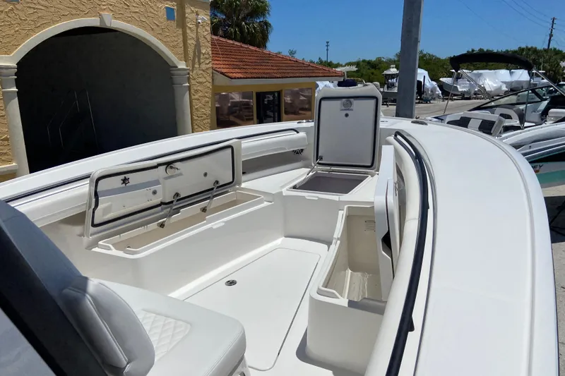 Slide: The Image of 2026 Regulator 28 boat interior with open storage compartments and seating. - 20