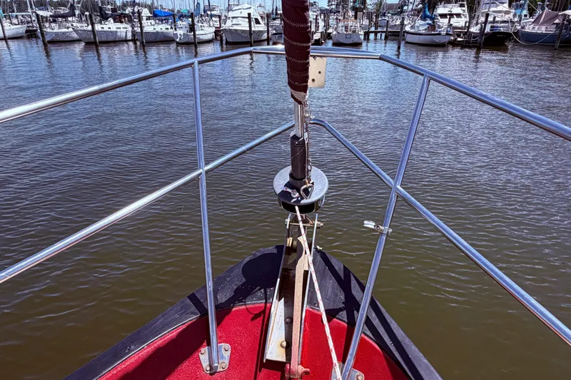 Slide: The Image of Bow view of 1985 Lancer Yachts 40 Motorsailer in a marina setting. - 10