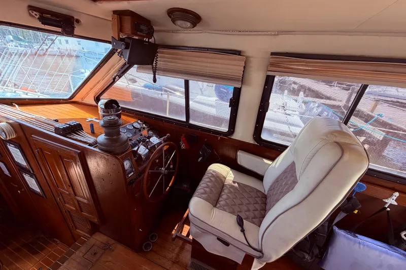 Slide: The Image of Interior helm of 1985 Lancer Yachts 40 Motorsailer with steering wheel and controls. - 29