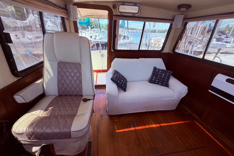 Slide: The Image of Interior of 1985 Lancer Yachts 40 Motorsailer with seating and nautical decor. - 31