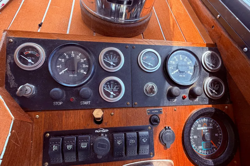 Slide: The Image of Control panel of a 1985 Lancer Yachts 40 Motorsailer with gauges and switches. - 37