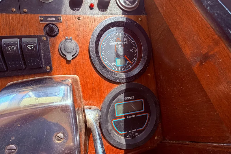 Slide: The Image of Control panel of a 1985 Lancer Yachts 40 Motorsailer with gauges and switches. - 38