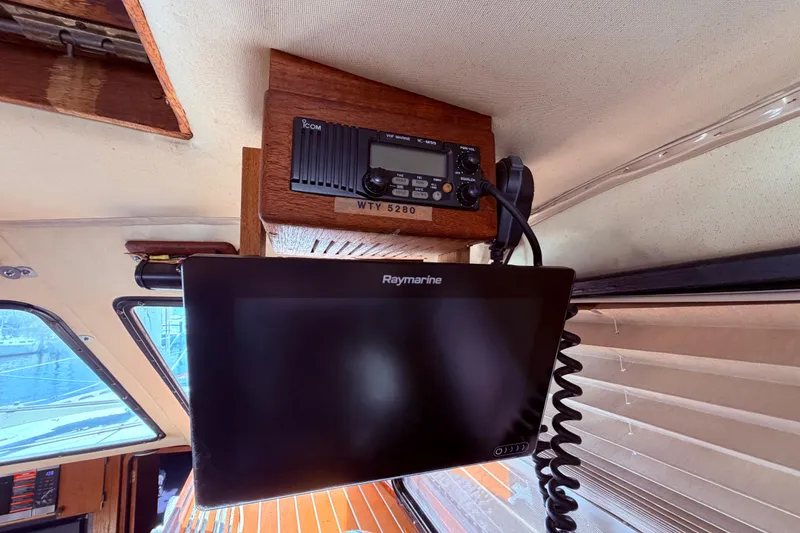 Slide: The Image of Interior of 1985 Lancer Yachts 40 Motorsailer with Icom radio and Raymarine display. - 39