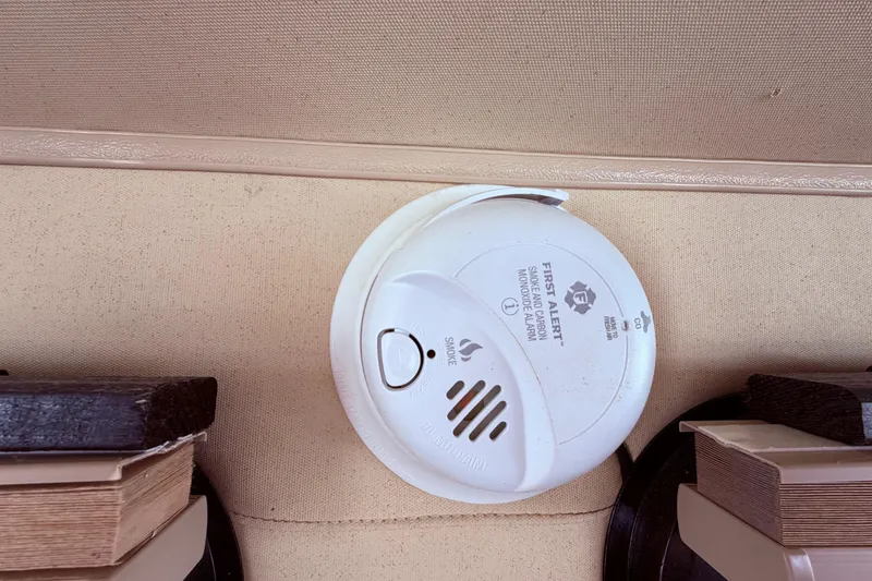 Slide: The Image of Smoke and carbon monoxide alarm on 1985 Lancer Yachts 40 Motorsailer interior ceiling. - 40