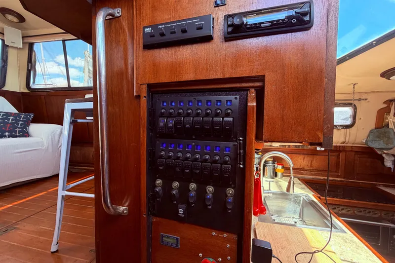 Slide: The Image of Interior of 1985 Lancer Yachts 40 Motorsailer with control panel and kitchen area. - 48