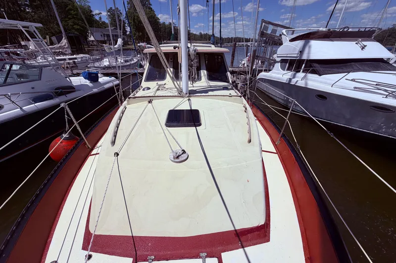 Slide: The Image of 1985 Lancer Yachts 40 Motorsailer docked among other boats on a sunny day. - 5