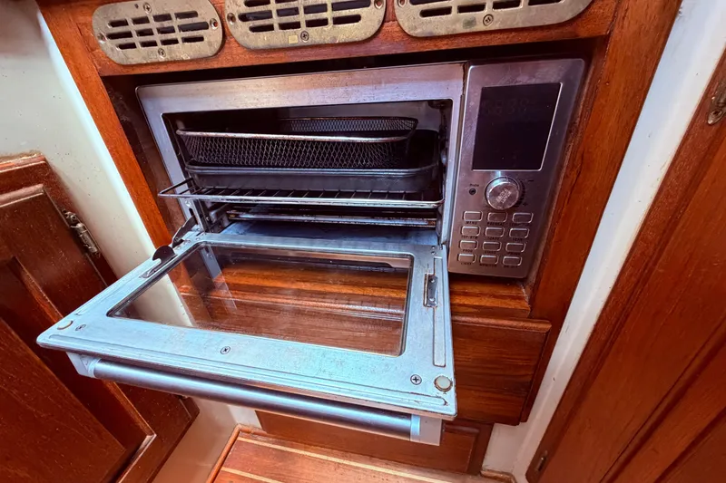 Slide: The Image of Built-in microwave oven in 1985 Lancer Yachts 40 Motorsailer galley. - 57