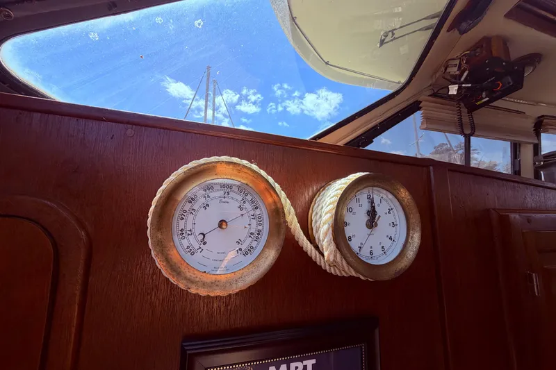 Slide: The Image of Interior of 1985 Lancer Yachts 40 Motorsailer with barometer and clock on wooden panel. - 60