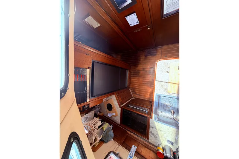 Slide: The Image of Interior of 1985 Lancer Yachts 40 Motorsailer with wood paneling and kitchen area. - 61