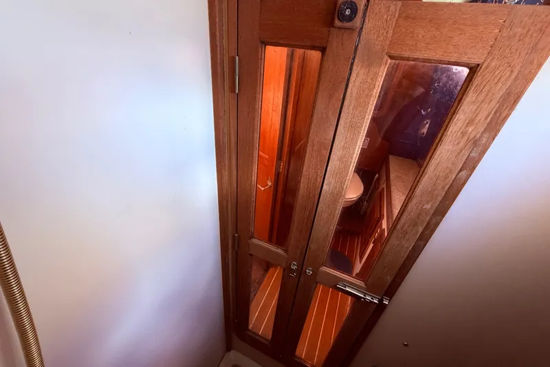 Slide: The Image of Interior view of 1985 Lancer Yachts 40 Motorsailer, featuring wooden doors and nautical design. - 71