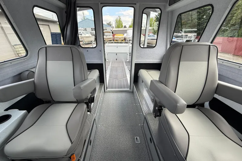 Slide: The Image of Interior of 2026 KingFisher 2825 Coastal Express boat with modern seating and spacious layout. - 11