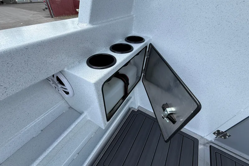 Slide: The Image of Interior view of 2026 KingFisher 2825 Coastal Express boat with storage compartment and cup holders. - 24
