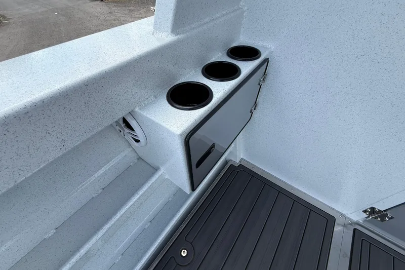 Slide: The Image of Interior of 2026 KingFisher 2825 Coastal Express boat with cup holders and storage. - 25