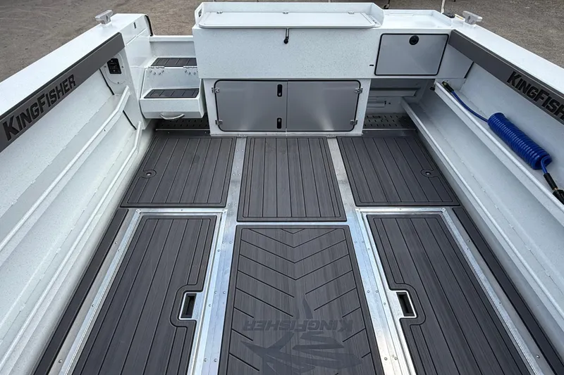 Slide: The Image of Interior view of 2026 KingFisher 2825 Coastal Express boat, featuring sleek deck design. - 34