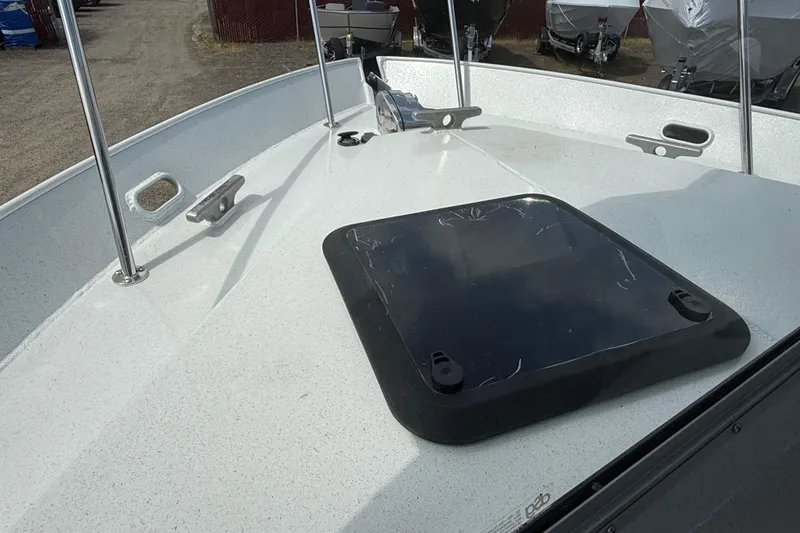Slide: The Image of 2026 KingFisher 2825 Coastal Express boat deck with hatch and cleats. - 36