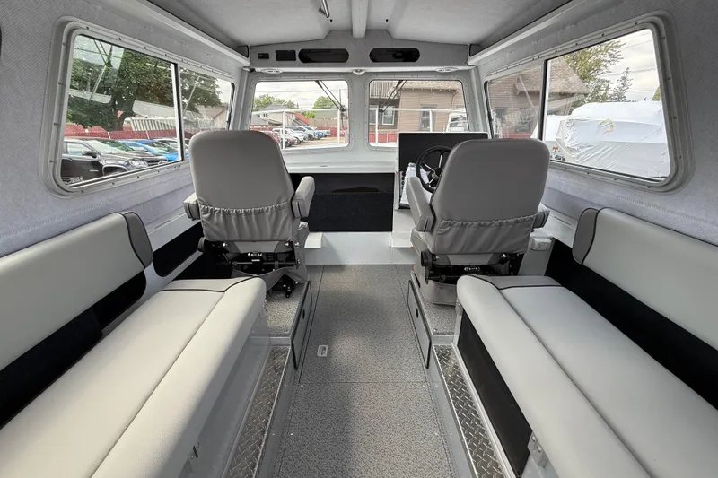 Slide: The Image of Interior of 2026 KingFisher 2825 Coastal Express boat, featuring spacious seating and modern design. - 6