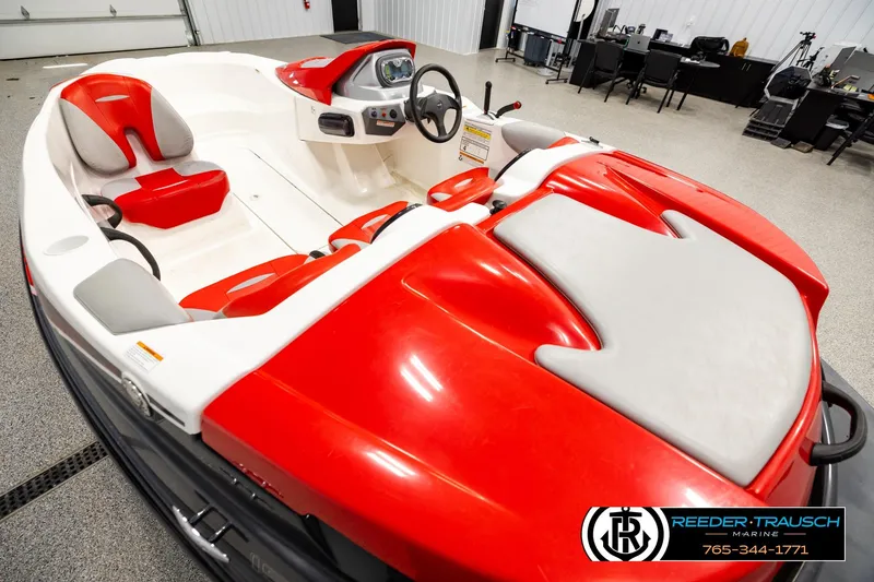 Slide: The Image of 2007 Sea Doo 150 Speedster in a showroom, featuring red and white seating. - 10