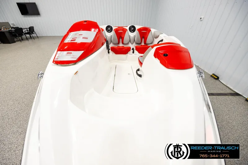 Slide: The Image of 2007 Sea Doo 150 Speedster boat with red and white interior in showroom. - 15