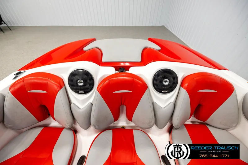 Slide: The Image of 2007 Sea Doo 150 Speedster interior with red and gray seating, featuring speakers. - 17