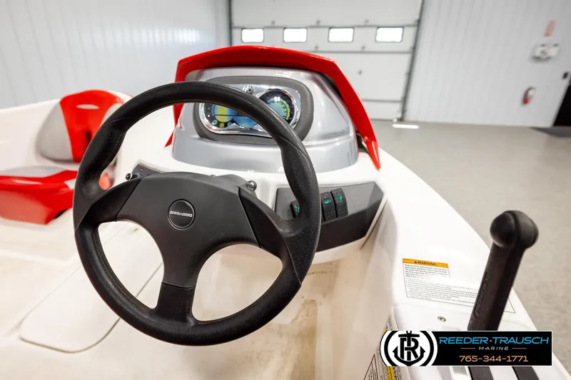 Slide: The Image of 2007 Sea Doo 150 Speedster dashboard with steering wheel and controls in a garage setting. - 19